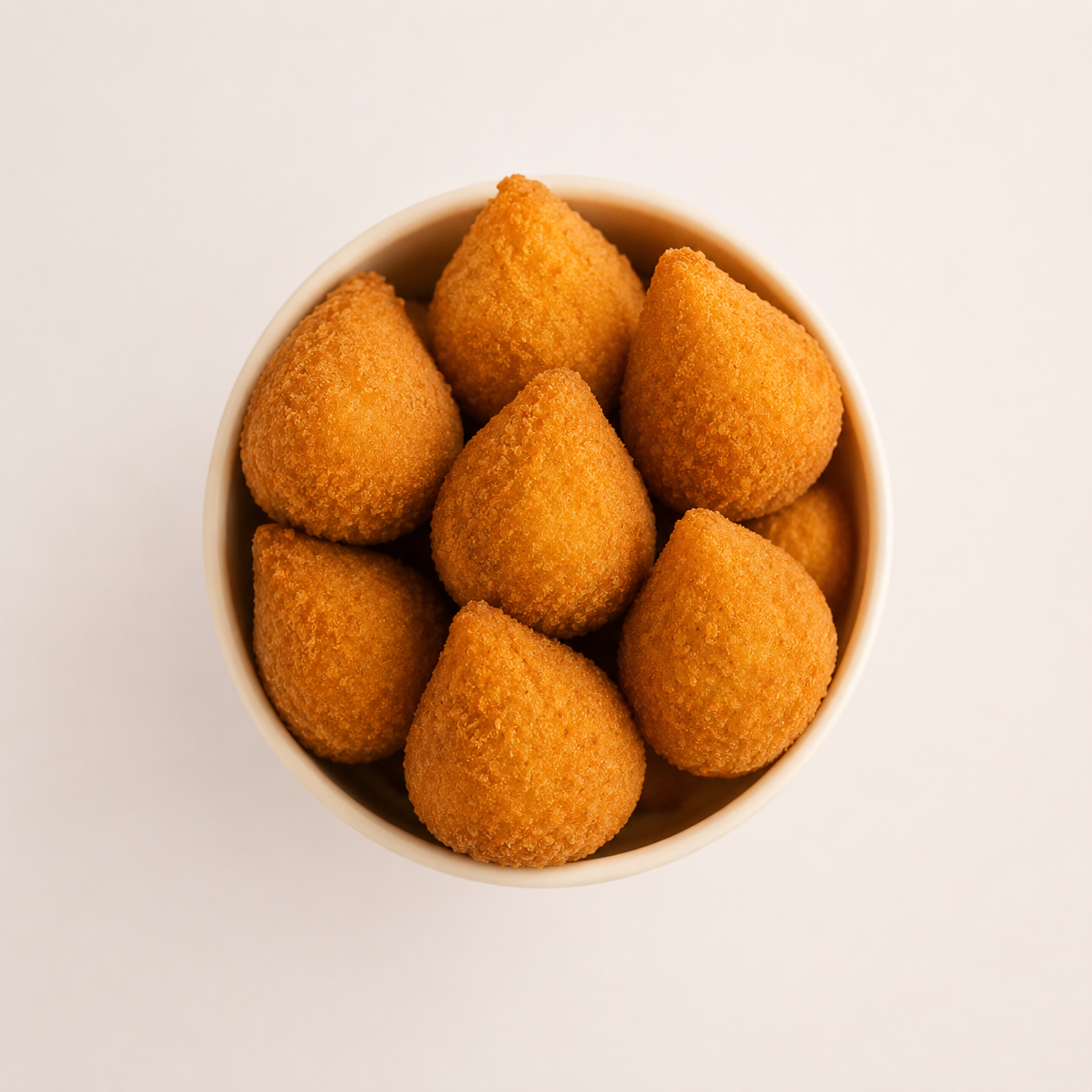 Smack & Snack chicken coxinhas — fresh-fried Brazilian-style crispy bites in a cup, served at Tampa Premium Outlets and The Florida Mall