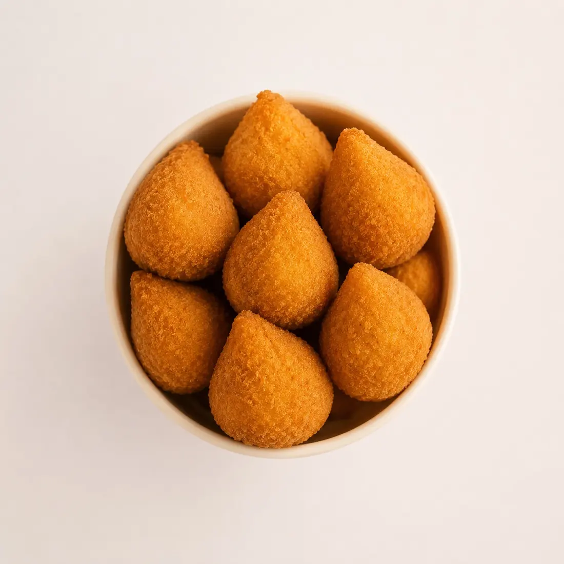Smack & Snack chicken coxinhas — fresh-fried Brazilian-style crispy bites in a cup, served at Tampa Premium Outlets and The Florida Mall